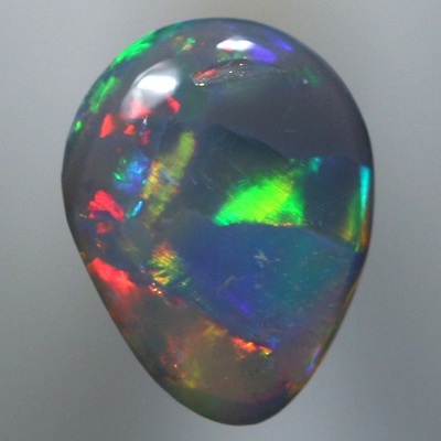 SOLID SEMI BLACK OPAL Large rainbow rolling flashes. Bright.